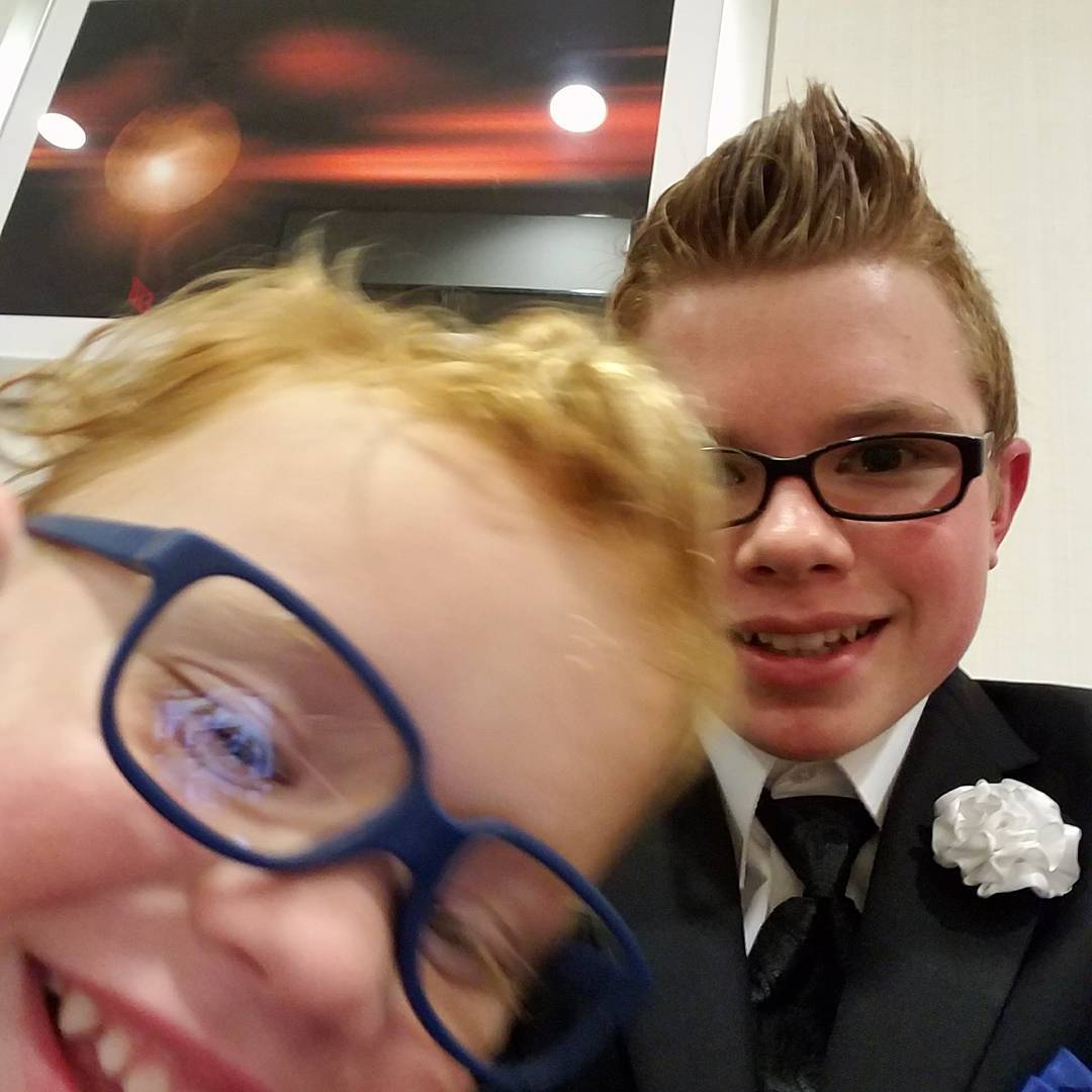 A selfie of Ryleigh Newman and his younger brother, both in suits, at the MDA Toast to Life Gala in downtown Jacksonville, October 2017.