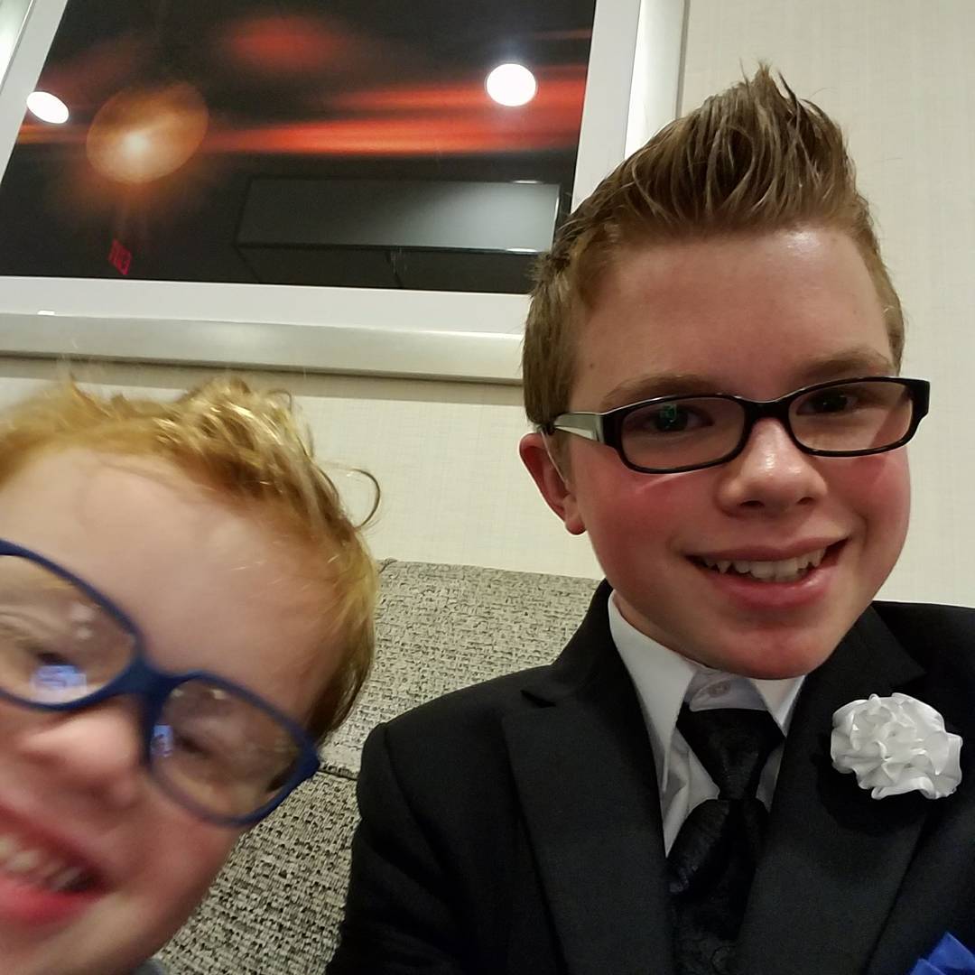 Ryleigh Newman in a suit representing the Muscular Dystrophy Association as Florida State Ambassador.