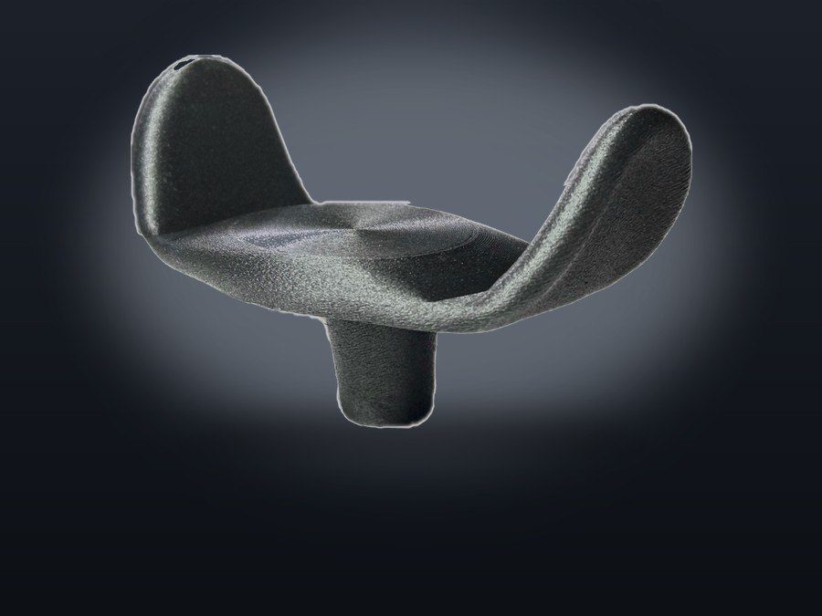 The Rockstar Health U-1, a 3D printed wheelchair joystick topper with a broad concave surface and two raised wings.